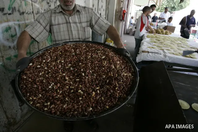 A Palestinian man during equipping the pistachios for the (Velours) on the first day of holy fasting month of Ramadan in the town of Rafah, southern Gaza Strip on Aug. 1, 2011. Throughout the holy month of Ramadan devout...