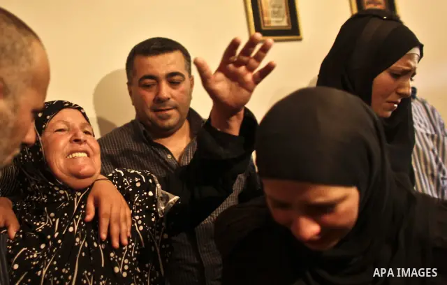 Palestinian women cry during the funeral of Moatasem Edwan ,22, and Ali Khalifeh, 25, who were killed by Israeli military in the Qalandiya refugee camp near the West Bank city of Ramallah, Monday, Aug. 1, 2011. A Palesti...