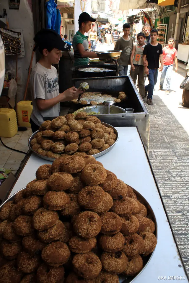 A Palestinian vendor prepares traditional foods "falafel" on the first day of the Muslim holy month of Ramadan, in a shop in the West Bank city of Nablus, Monday, Aug. 1, 2011. Muslims throughout the world are celebratin...