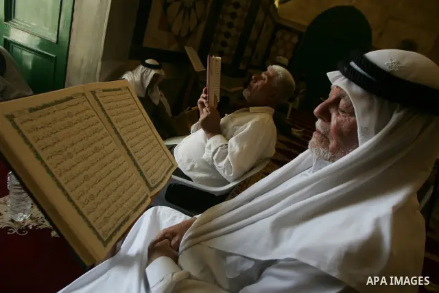 A Palestinian man reads the holy koran on the first day of holy fasting month of Ramadan in Jerusalem on Aug 1, 2011. Throughout the holy month of Ramadan devout Muslims must abstain from food, drink and sex from dawn un...