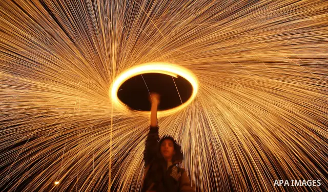 Palestinian boy plays with fireworks to celebrate the beginning of the Muslim holy fasting month of Ramadan in Gaza City on 01 August 2011. Muslims throughout the world are celebrating the holy fasting month of Ramadan,...