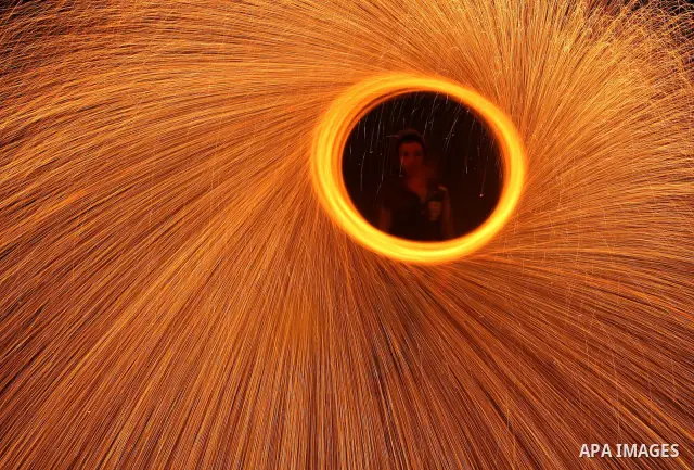 Palestinian boy plays with fireworks to celebrate the beginning of the Muslim holy fasting month of Ramadan in Gaza City on 01 August 2011. Muslims throughout the world are celebrating the holy fasting month of Ramadan,...