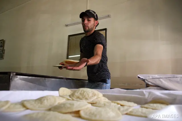 A Palestinian vendor prepares qatayef, a traditional pancake for Ramadan, at a shop in the West Bank city of Ramallah August 2, 2011. Muslims around the world abstain from eating, drinking and conducting sexual relations...
