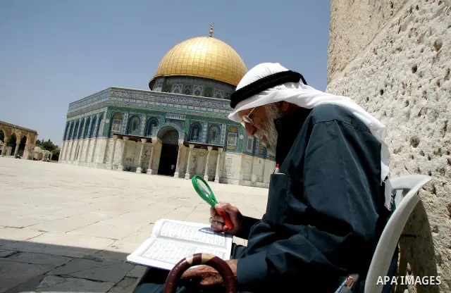A Palestinian man reads the holy koran on the first day of holy fasting month of Ramadan. Throughout the holy month of Ramadan devout Muslims must abstain from food, drink and sex from dawn until sunset when they break t...