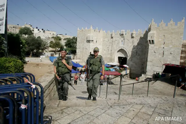sraeli soldiers walk in Al-Aqsa mosque in the old city of Jerusalem on Aug 2, 2011. Photo by Mahfouz Abu Turk