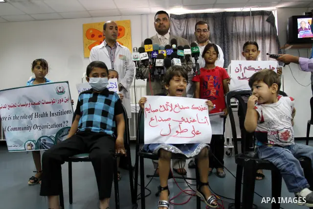 Palestinian official at Al-Rantisi hospital for the children delivers speech during a protest for the lack of medicine, in Gaza city on Aug. 3, 2011, demanding for the introduction of medicines. Photo by Mohammed Asad
