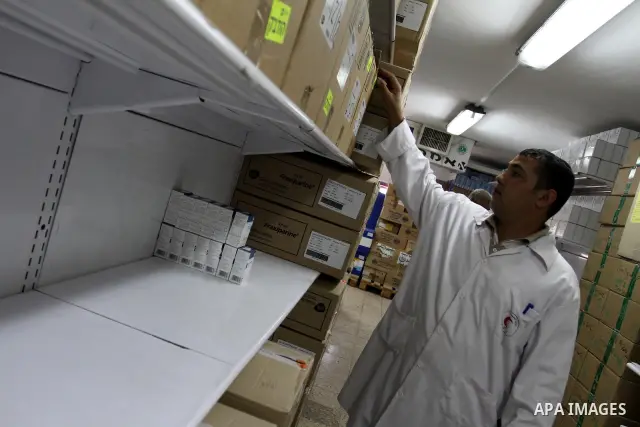 A Palestinian doctor check out medicines at the medical stores where shortage of medicine still continous for the thalassemia patients in Gaza city on Aug. 3, 2011. Photo by Mohammed Asad