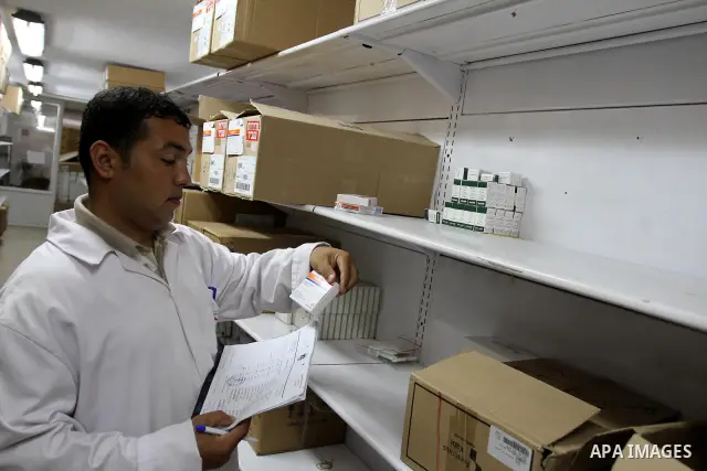 A Palestinian doctor check out medicines at the medical stores where shortage of medicine still continous for the thalassemia patients in Gaza city on Aug. 3, 2011. Photo by Mohammed Asad