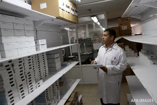 A Palestinian doctor check out medicines at the medical stores where shortage of medicine still continous for the thalassemia patients in Gaza city on Aug. 3, 2011. Photo by Mohammed Asad