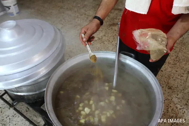 Palestinian bakers prepare meat and rice " free food" for 'Iftar', at charity in Gaza city on Aug. 3, 2011. where provides a free meal all the year round to poor Muslims during the holy fasting month of Ramadan, when obs...