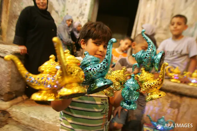 A Palestinians boy sells lanterns in the holy month of Ramadan in Jerusalem's Old City on Aug. 3, 2011. Muslims around the world abstain from eating, drinking and sexual relations from sunrise to sunset during Ramadan, t...