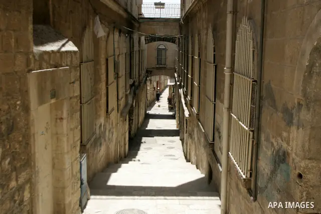 A Palestinians man walks in the alleys of Jerusalem's Old City in the holy month of Ramadan in on Aug. 3, 2011. Muslims around the world abstain from eating, drinking and sexual relations from sunrise to sunset during Ra...