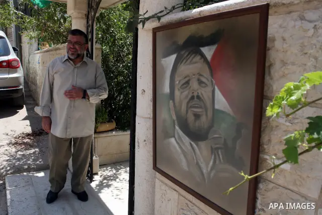 A Palestinian commander of the Hamas Islamist movement, Sheikh Hassan Yusef, 56, stands near his home in the West Bank city of Ramallah after he was released from an Israeli jails, on Aug. 4, 2011. as Israel free 770 Isr...