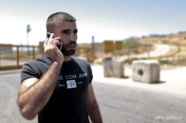 Palestinian prisoners seen crossing the border after they were released from Israeli prison, at the checkpoint of Betwnia next to the Israeli Military prison of Ofer, south of the West Bank town of Ramallah, 04 August 20...