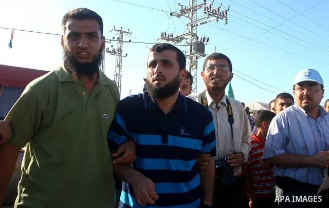 Palestinians welcome back prisoners released from Israeli prisons at the Erez checkpoint in the northern Gaza Strip, following their release at the Erez crossing by Israeli border police, 04 August 2011. In total, 75 Pal...