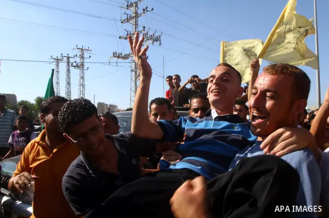 Palestinians welcome back prisoners released from Israeli prisons at the Erez checkpoint in the northern Gaza Strip, following their release at the Erez crossing by Israeli border police, 04 August 2011. In total, 75 Pal...
