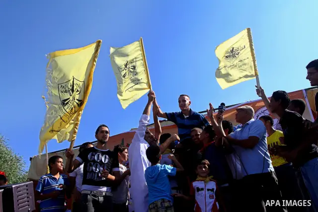 Palestinians welcome back prisoners released from Israeli prisons at the Erez checkpoint in the northern Gaza Strip, following their release at the Erez crossing by Israeli border police, 04 August 2011. In total, 75 Pal...