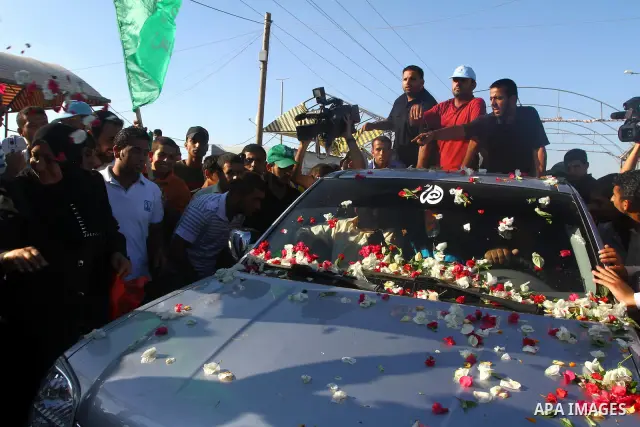 Palestinians welcome back prisoners released from Israeli prisons at the Erez checkpoint in the northern Gaza Strip, following their release at the Erez crossing by Israeli border police, 04 August 2011. In total, 75 Pal...