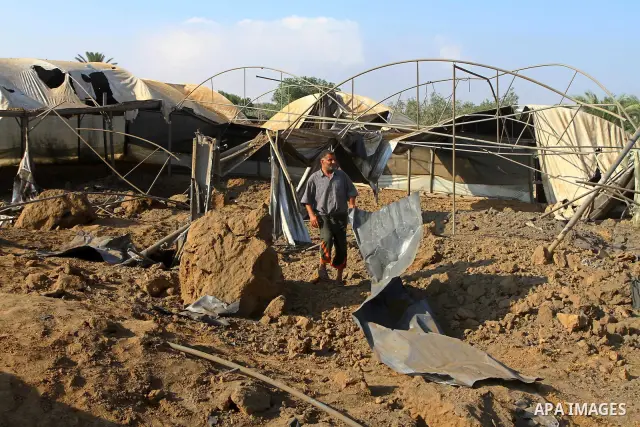 Palestinian man inspect the site of an Israeli overnight air raid in Dier al-Balah in the central of Gaza Strip on August 5, 2011. Israel's air force carried out three raids on the Gaza Strip without causing any casualti...