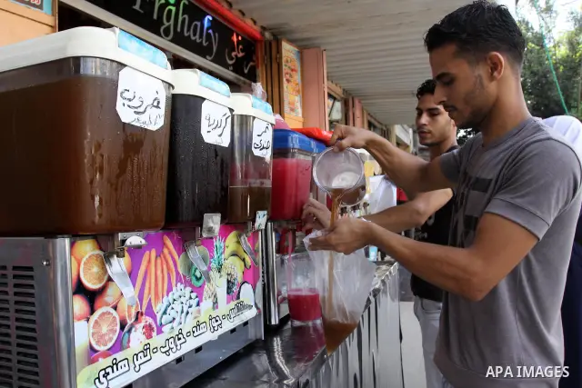 Palestinian vendor prepares different types of juice at his shop on the sixth day of the holy month of Ramadan in Gaza City on Aug. 6, 2011 . Muslims all over the world fast from dawn to dusk during the holy month of Ram...