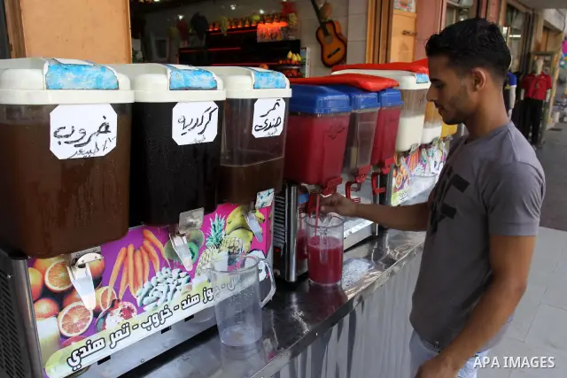 Palestinian vendor prepares different types of juice at his shop on the sixth day of the holy month of Ramadan in Gaza City on Aug. 6, 2011 . Muslims all over the world fast from dawn to dusk during the holy month of Ram...