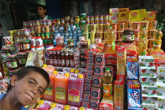 A Palestinian vendor sells food at a market in Gaza city on Aug. 6, 2011. Muslims around the world abstain from eating, drinking and conducting sexual relations from sunrise to sunset during Ramadan, the holiest month in...
