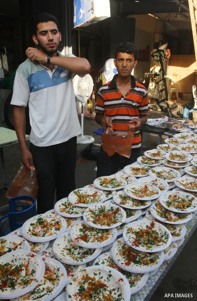 A Palestinian vendor sells chickpeas at a market in Gaza city on Aug. 6, 2011. Muslims around the world abstain from eating, drinking and conducting sexual relations from sunrise to sunset during Ramadan, the holiest mon...