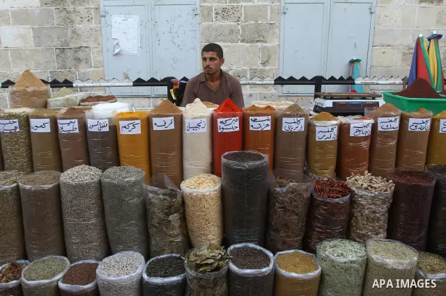 A Palestinian vendor sells spices at a market in Gaza city on Aug. 6, 2011. Muslims around the world abstain from eating, drinking and conducting sexual relations from sunrise to sunset during Ramadan, the holiest month...