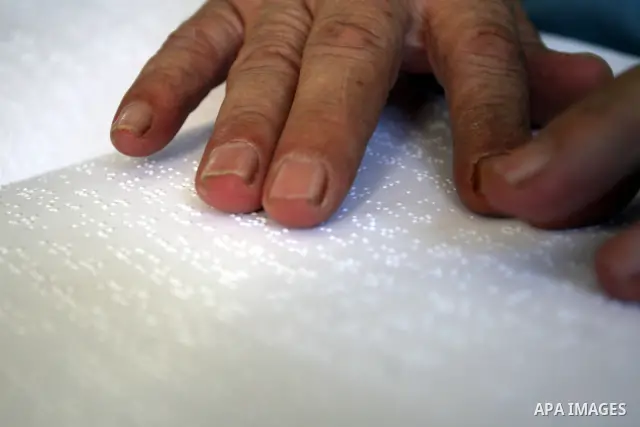 A Palestinian old man, Abdel Fattah Mubarak, 67 years, reads the holy koran in Braille at a Mosque in the West Bank city of Ramallah, on Aug. 7, 2011. Muslims around the world are observing the holy fasting month of Rama...