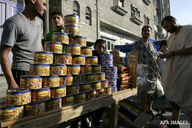 A Palestinian vendor sells food at a market in Rafah, southern Gaza Strip on Aug. 7, 2011. Muslims around the world abstain from eating, drinking and conducting sexual relations from sunrise to sunset during Ramadan, the...