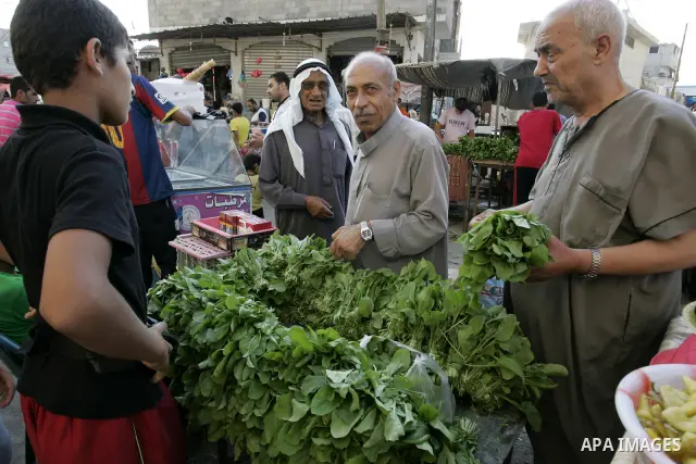 Palestinians shop for food at a market in Rafah southern Gaza Strip on Augu. 7, 2011. Muslims around the world abstain from eating, drinking and conducting sexual relations from sunrise to sunset during Ramadan, the holi...