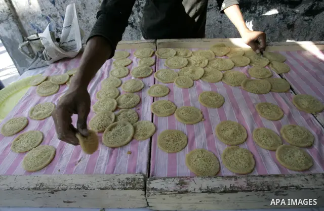 A Palestinian vendor prepares qatayef, a traditional pancake for Ramadan, at a shop in Rafah, southern Gaza Strip on Aug. 7, 2011. Muslims around the world abstain from eating, drinking and conducting sexual relations fr...