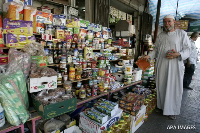 A Palestinian vendor sells food at a market in Rafah, southern Gaza Strip on Aug. 7, 2011. Muslims around the world abstain from eating, drinking and conducting sexual relations from sunrise to sunset during Ramadan, the...