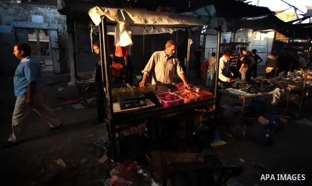 Palestinian kids sleep on a donkey cart in the market before Palestinians break their fast on the first Friday of Ramadan in the Jabaliya Refugee Camp in the northern Gaza Strip on 07 August 2011 Muslims throughout the w...