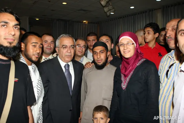 Palestinian Prime Minister Salam Fayyad, participates in the annual Ramadan breakfast for prisoners and families of the martyrs on Aug 8, 2011. Photo by Mustafa Abu Dayeh