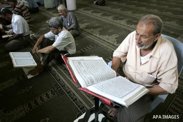 A Palestinian Muslim reads the holy Koran at a Mosque in Rafah, southern Gaza Strip on Aug. 9, 2011. Muslims around the world refrain from eating, drinking and sexual intercourse from dawn till dusk during Ramadan, the h...
