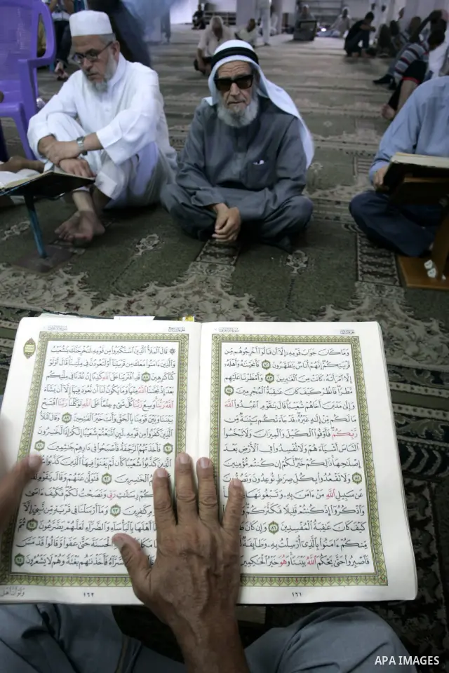 A Palestinian Muslim reads the holy Koran at a Mosque in Rafah, southern Gaza Strip on Aug. 9, 2011. Muslims around the world refrain from eating, drinking and sexual intercourse from dawn till dusk during Ramadan, the h...