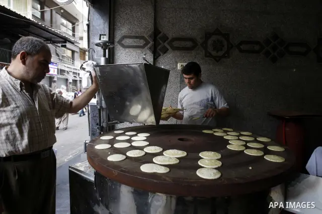 A Palestinian vendor prepares qatayef, a popular sweet during Ramadan, in a shop in Gaza city on Aug.10, 2011. Muslims around the world are observing the holy fasting month of Ramadan where they refrain from eating, drin...