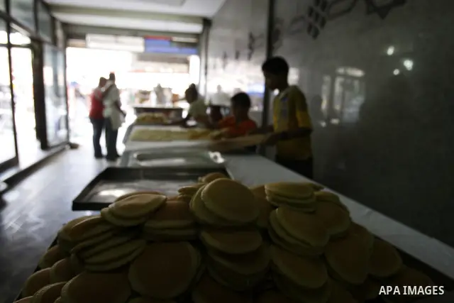 Palestinian boys prepare qatayef, a popular sweet to sell it during Ramadan, at a shop in Gaza city on Aug.10, 2011. Muslims around the world are observing the holy fasting month of Ramadan where they refrain from eating...