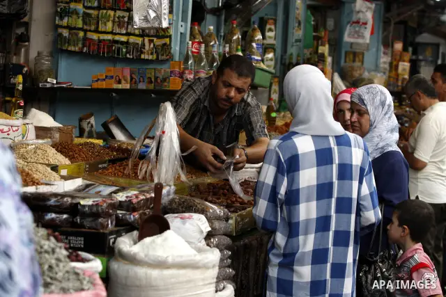 Palestinians shop for food at a market in Gaza city on Aug. 10, 2011. Muslims around the world abstain from eating, drinking and conducting sexual relations from sunrise to sunset during Ramadan, the holiest month in the...