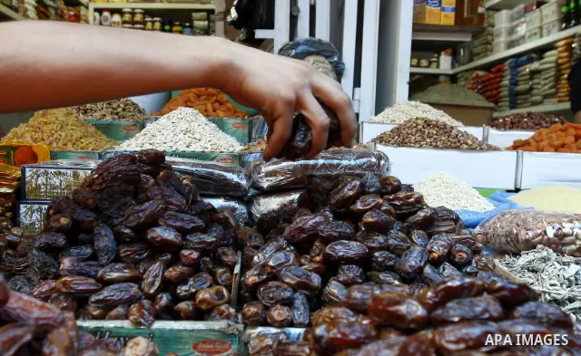 A Palestinian vendor sells dates in his shop at a market in Gaza city Aug. 10, 2011. Muslims around the world abstain from eating, drinking and conducting sexual relations from sunrise to sunset during Ramadan, the holie...
