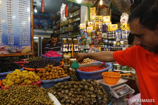 A Palestinian vendor sells pickles in his shop at a market in Gaza city Aug. 10, 2011. Muslims around the world abstain from eating, drinking and conducting sexual relations from sunrise to sunset during Ramadan, the hol...