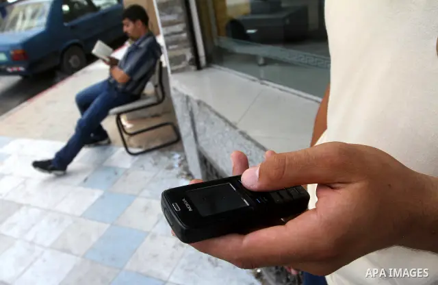 Palestinians try to call each other through the Palestinian communication services (Jawwal) but there are problems in communication because of the damage of Israeli attacks, yesterday evening in Gaza city on Aug. 10, 201...
