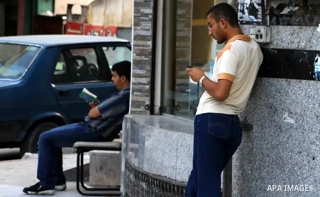 Palestinians try to call each other through the Palestinian communication services (Jawwal) but there are problems in communication because of the damage of Israeli attacks, yesterday evening in Gaza city on Aug. 10, 201...