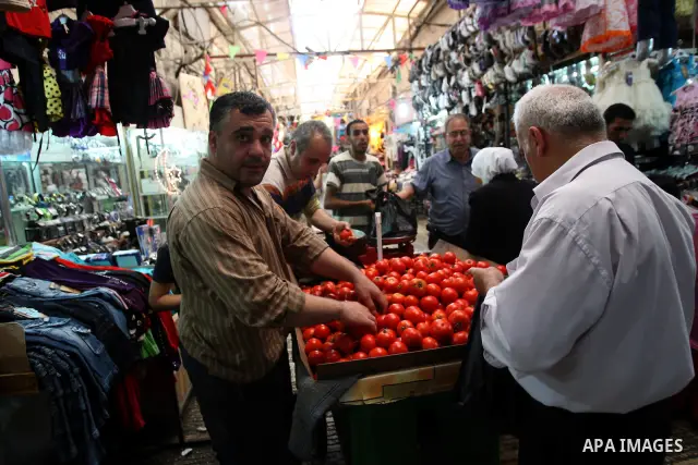 Palestinians shop for vegetables at a market in the West Bank city of Nablus, on Aug. 10, 2011. Muslims around the world are observing the holy fasting month of Ramadan where they refrain from eating, drinking, smoking f...