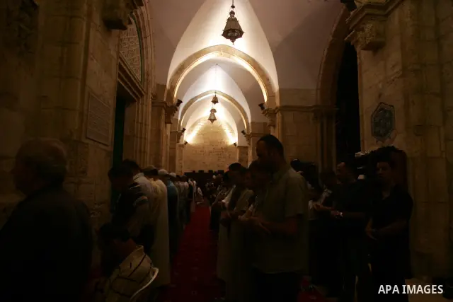 Palestinian Muslims perform al-Taraweeh prayer on the night of the tenth of the holiest month of Ramadan at Al Aqsa Mosque in the old city of Jerusalme on Aug. 10, 2011. Muslims around the world are observing the holy fa...
