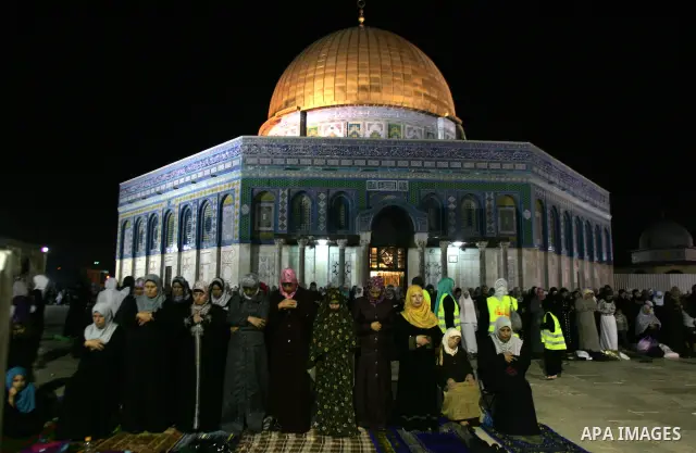 Palestinian Muslims perform al-Taraweeh prayer on the night of the tenth of the holiest month of Ramadan at Al Aqsa Mosque in the old city of Jerusalme on Aug. 10, 2011. Muslims around the world are observing the holy fa...