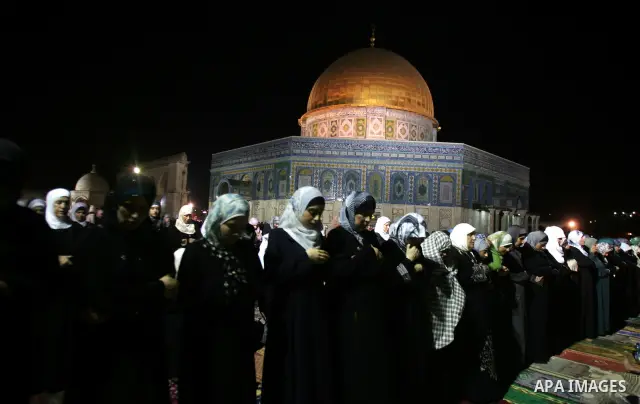 Palestinian Muslims perform al-Taraweeh prayer on the night of the tenth of the holiest month of Ramadan at Al Aqsa Mosque in the old city of Jerusalme on Aug. 10, 2011. Muslims around the world are observing the holy fa...