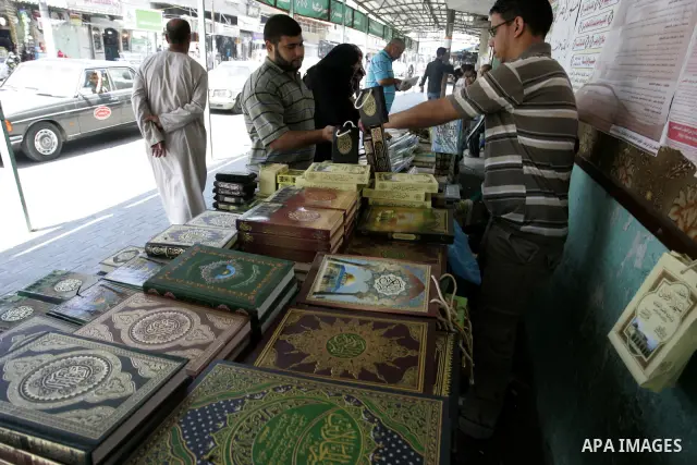 A Palestinian man sells the holy koran and Islamic books in his shop at a market in Rafah, southern Gaza Strip on Aug. 11, 2011. Muslims throughout the world are marking the month of Ramadan, during which they refrain fr...