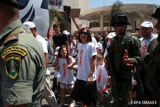 Foreign supporters with the Palestinian people take part in a demonstration in the West Bank city of Nablus, on Aug. 11, 2011. In support with the Palestinian people, where gather more than 1,200 activists from 22 foreig...